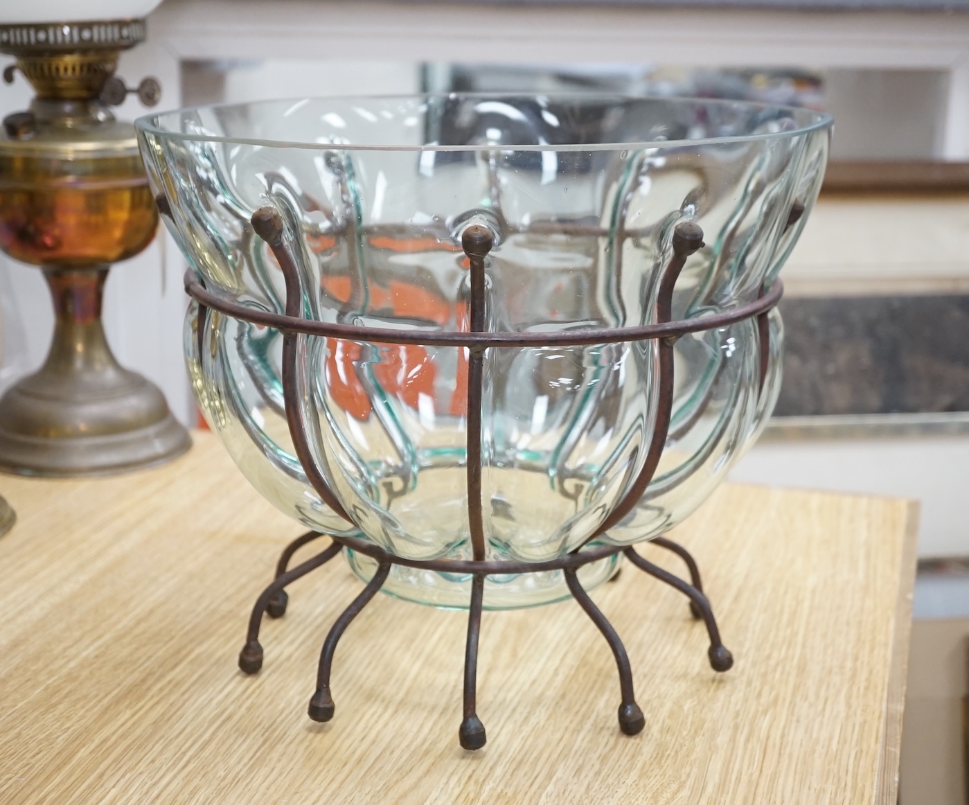 A glass vase and a similar bowl with wrought iron stand, vase 38cm high. Condition - good